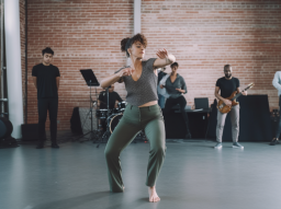 Tor_woman_performs_with_music_in_modern_dance_room_at_a_studio__c86e84e5-943e-43ca-befd-3ada544323d0