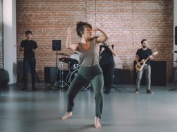 Tor_woman_performs_with_music_in_modern_dance_room_at_a_studio__ef962863-c695-4df8-9930-9817b83d9e83